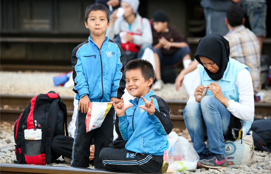 Two Syrian boys on railway tracks