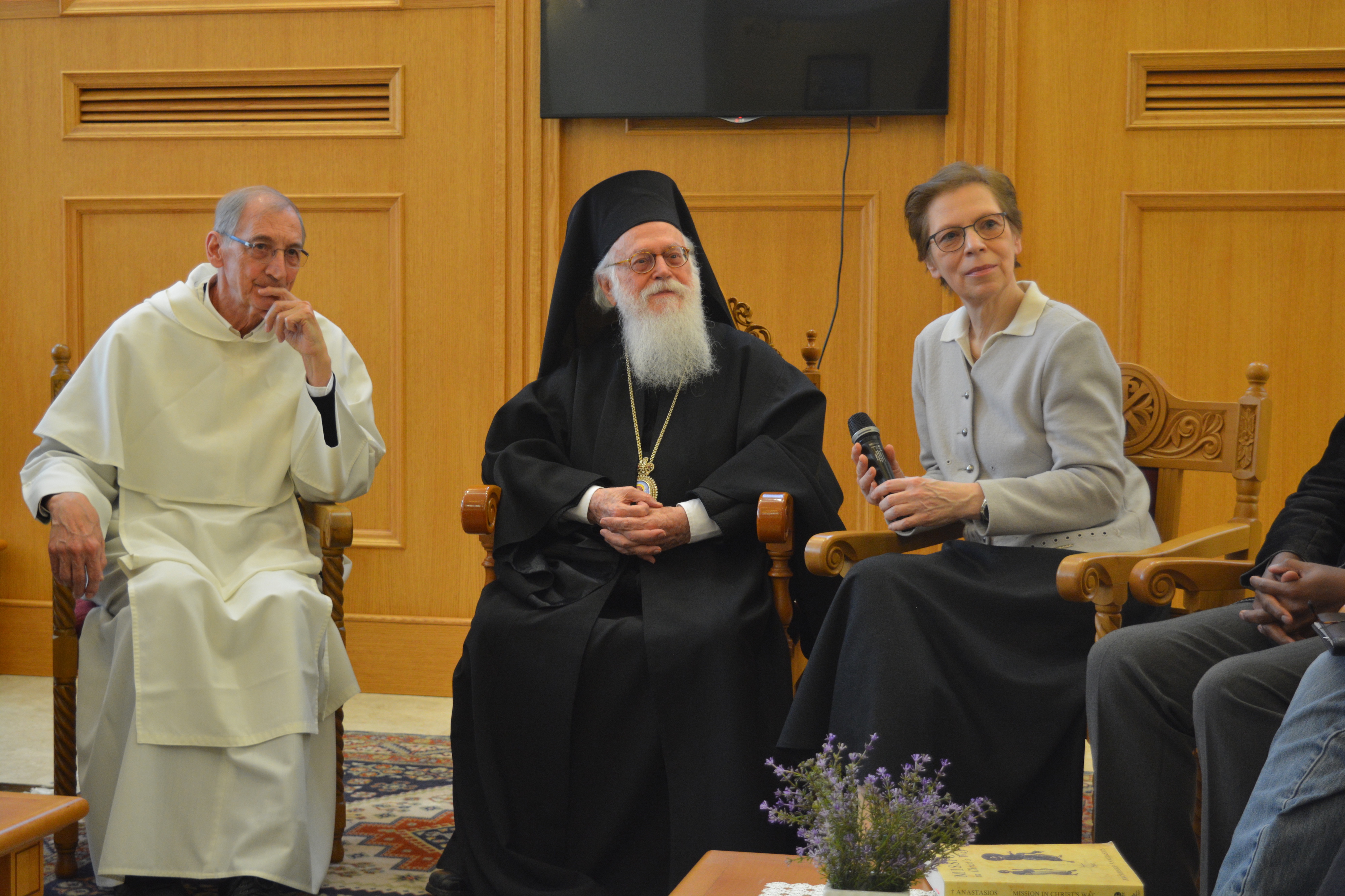 The archbishop listening to the presentation of the group members